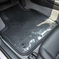 Transparent vinyl liner fitted over clean car floor mat, edge guards sealed