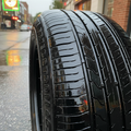 Glossy black tire sidewall reflecting light after gel application, no sling